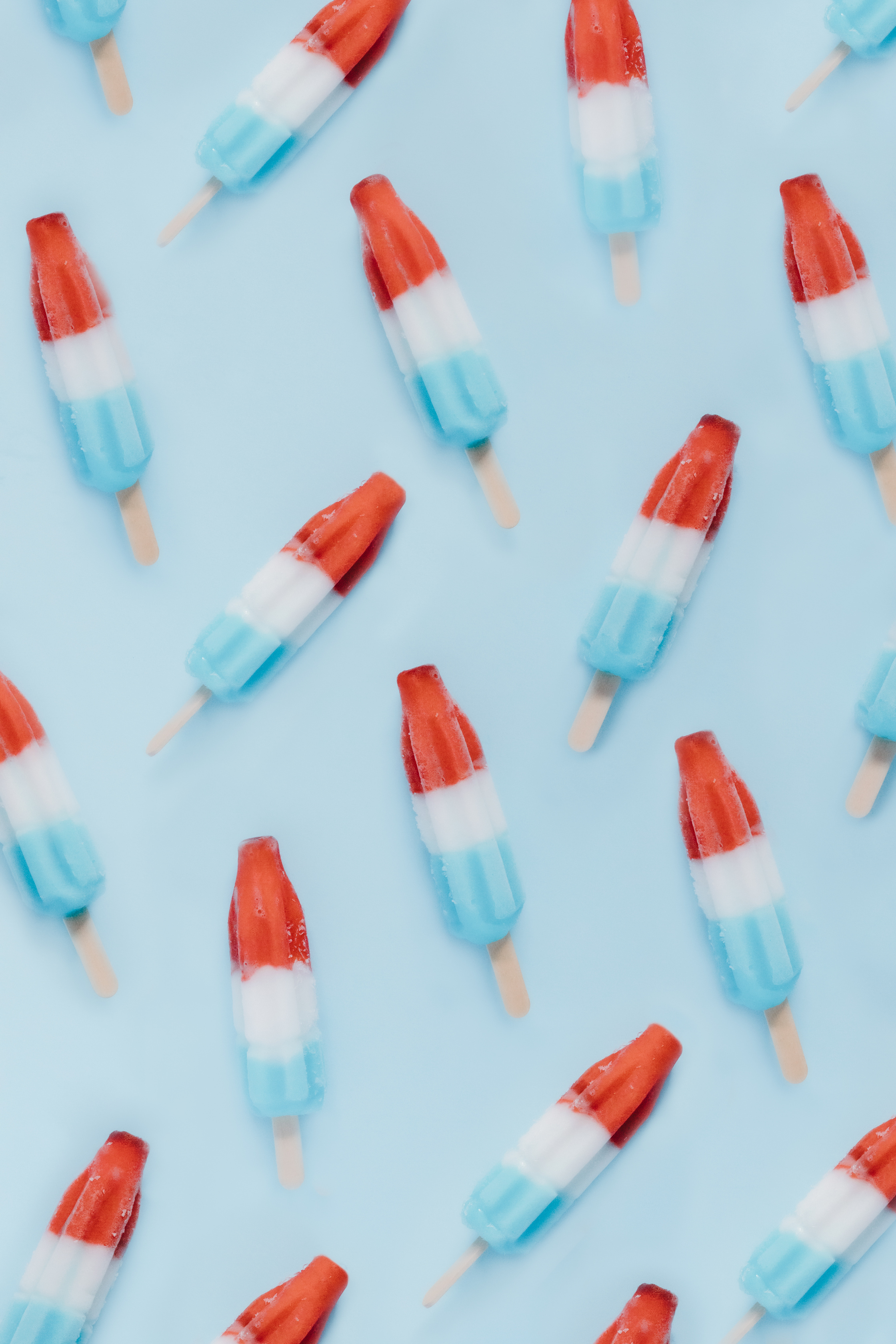 Red, White, and Blue Popsicles on a blue background